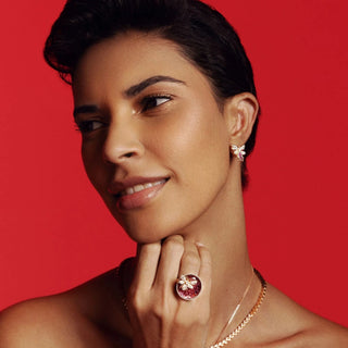 Woman wearing ring and earrings, product AAAAAAAAAAAAAA