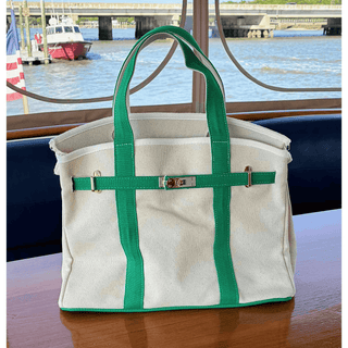 Boatkin bag with green straps on a boat