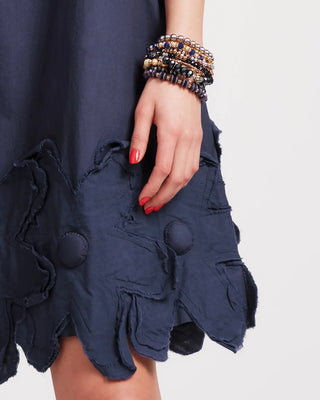 Navy Zinnia dress with floral detail and bracelets