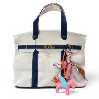 Pegasus bag charm on natural and navy boatkin bag