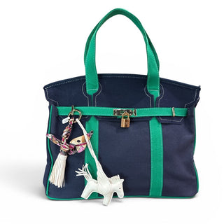 Pegasus bag charm on navy and green boatkin bag