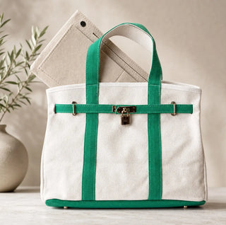 a beige with green straps boatkin bag