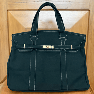 Black Canvas Boatkin on leather chair