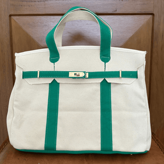 Green canvas boatkin on leather chair