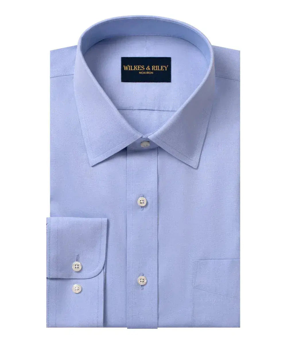 well fitting dress shirt Slim Fit Royal Blue Button Up button front patch chest pocket relaxed chest and sleeves with a roomier waist hits below waist model is approx How Should Dress Shirts Fit?
